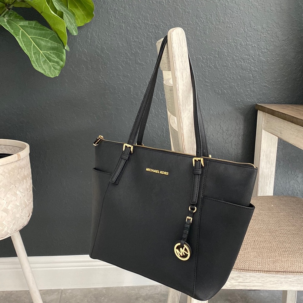 SOLD Black and gold Michael Kors large tote bag with feet